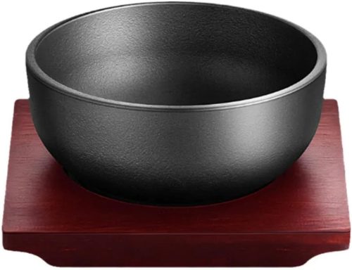 Cast iron dolsot bibimbap bowl with wooden base, 31 oz heat-retaining design for rice and stews.