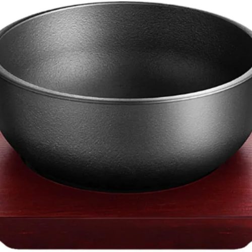 Cast iron dolsot bibimbap bowl with wooden base, 31 oz heat-retaining design for rice and stews.