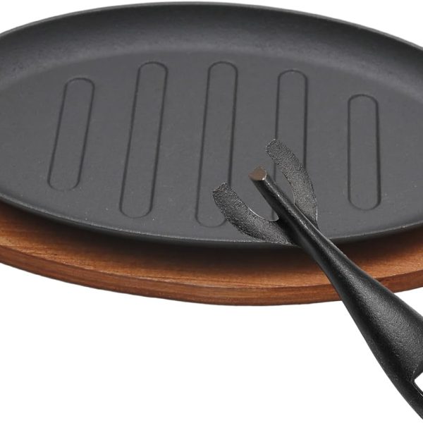 Cast iron steak plate with wooden base, round fajita server for household and restaurant use.