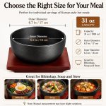Cast iron dolsot bibimbap bowl with wooden base, 31 oz heat-retaining design for rice and stews.